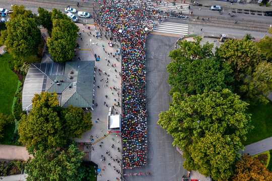 Aerial view on crowd of people who is starting their run on marathon event in Riga, Latvia.