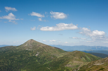 Fototapeta na wymiar panorama of mountain ranges and cloudy sky background