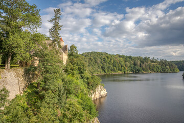 castle ruins on a rock above the river