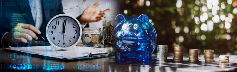 business people working at desk with piggy bank box.business finance saving and investment concept. hand put money coin into piggy bank for saving money wealth.