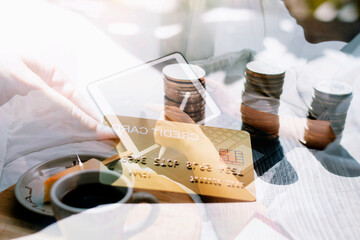 male hands holding a credit card and use mobile phone for Online payment online shopping