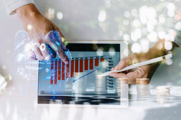 business people working at desk with piggy bank box.business finance saving and investment concept. hand put money coin into piggy bank for saving money wealth.