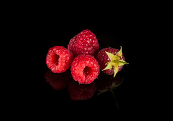 Raspberry isolated. Raspberries with leaf isolate. Raspberry with leaf isolated on black background. Free advertising space