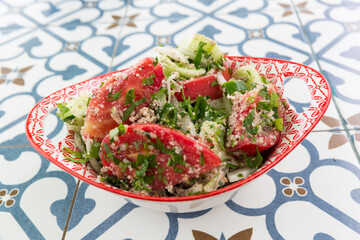 National Georgian salad of fresh vegetables, tomatoes and herbs, onions and cilantro.