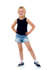 Cute girl standing with hands on her waist