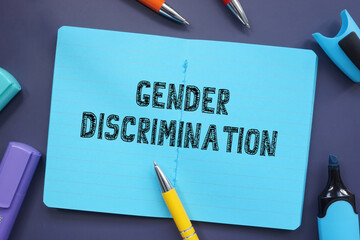 Financial concept about Gender Discrimination with phrase on the piece of paper.