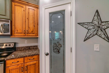 Pantry door with ornate glass panel with pantry signage