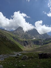 three big mountain cover with clouds