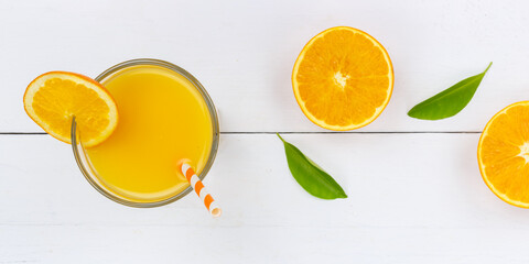 Orange juice drink on wooden board from above panorama