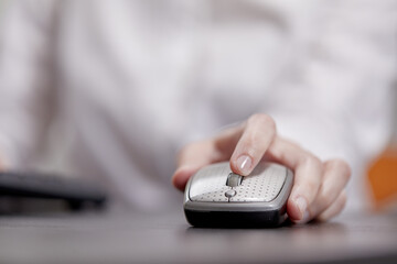 close up of businesswoman using computer mouse