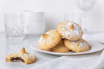 Chocolate filled shortbread cookies in a white kitchen
