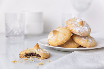 Chocolate filled shortbread cookies in a white kitchen