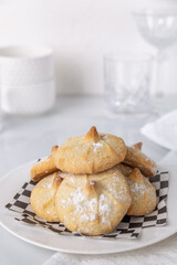 Chocolate filled shortbread cookies in a white kitchen