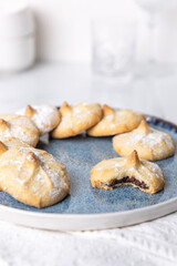 Chocolate filled shortbread cookies in a white kitchen