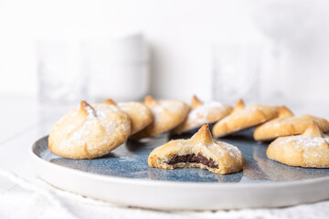 Chocolate filled shortbread cookies in a white kitchen
