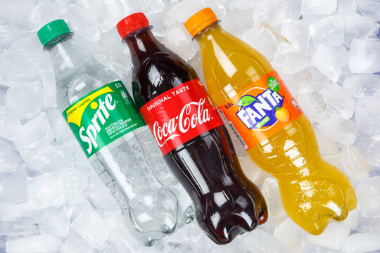 Coca Cola Coca-Cola Fanta Sprite lemonade drinks in plastic bottles on ice cubes
