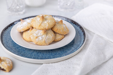 Chocolate filled shortbread cookies in a white kitchen