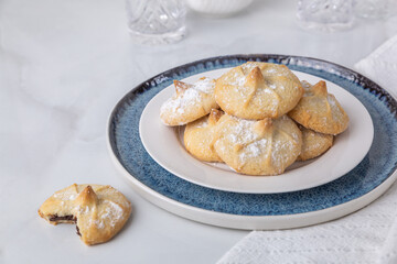 Chocolate filled shortbread cookies in a white kitchen