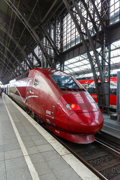 Thalys high-speed train at Cologne K&ouml;ln main railway station Hauptbahnhof Hbf portrait format in Germany