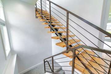Modern staircase with metal and wood floating steps - Powered by Adobe