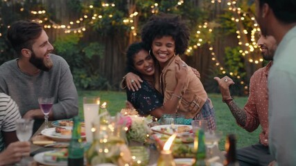 happy friends hugging celebrating reunion enjoying dinner party congratulating friend having fun evening together relaxing on weekend at home in backyard 4k footage - Powered by Adobe