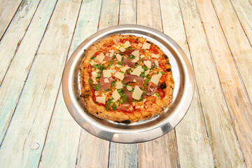 Serrano ham pizza with arugula and parmesan cheese slices with tomato and fine wheat flour dough