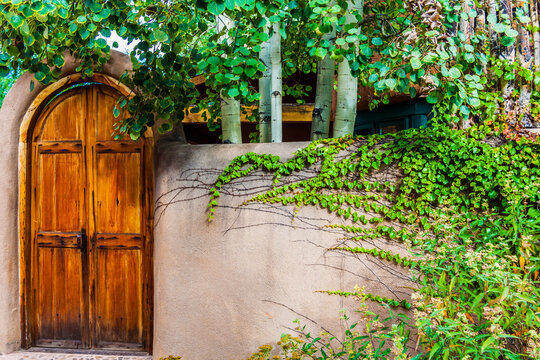 Hand Carved Door and Adobe Walls, Taos, New Mexico, USA