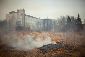 Smoke in the background of the building.