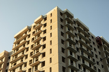 Unfinished apartment building. The basis for housing. Real estate market.