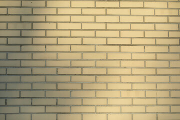 Obraz premium Beige brick wall. Texture of bricks in natural light.