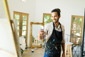 Handsome artist feeling proud of his work