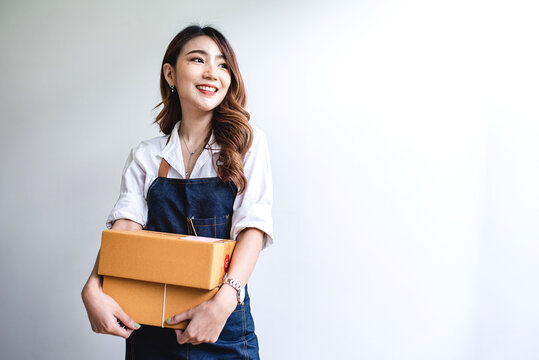 businesswoman start small business and successful SME entrepreneurs A woman works from home delivering parcels online. SME delivery concept and packaging