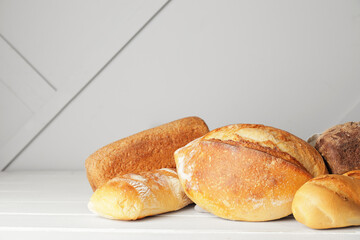 Different fresh bread on table