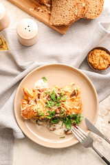 Plate with piece of delicious casserole with minced meat on table