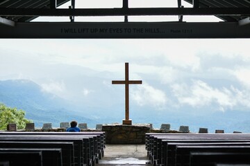 cross on a cliff mountainside chapel