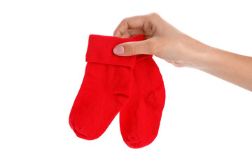 Woman holding baby socks on white background