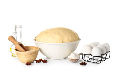 Bowl with fresh dough, dry yeast and ingredients on white background