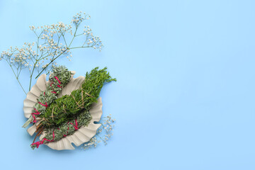 Different herbs for aura cleansing on color background