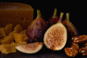 Closeup of figs against black background