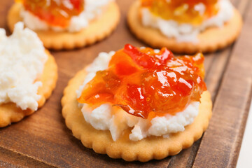 Delicious cracker with cottage cheese and jalapeno pepper jam, closeup