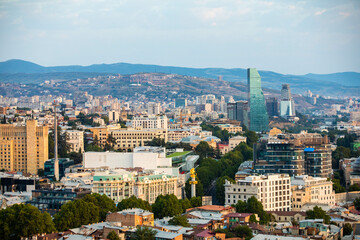 Fototapeta na wymiar Aerial panoramic view of Tbilisi city center at summer sunrise