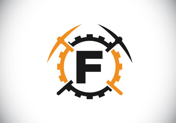 Initial F monogram letter alphabet with pickaxe and gear sign. Mining logo design concept. Modern vector logo for mining business and company identity.
