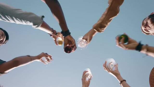 happy group of friends making toast celebrating friendship reunion drinking enjoying weekend gathering having fun party celebration relaxing on summer day view from below 4k 