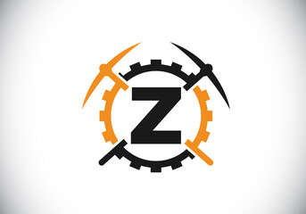 Obraz premium Initial Z monogram letter alphabet with pickaxe and gear sign. Mining logo design concept. Modern vector logo for mining business and company identity.