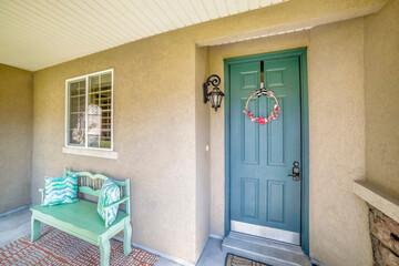 Fototapeta premium Blue green front door with wreath and digital entry access