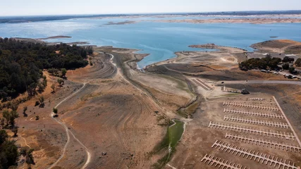 Poster Aerial view of the severe drought conditions of Folsom Lake, a reservoir in Folsom, California, USA. © Matt Gush