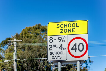 School zone road sign with speed limit 40 during before and after school hours in NSW, Australia....