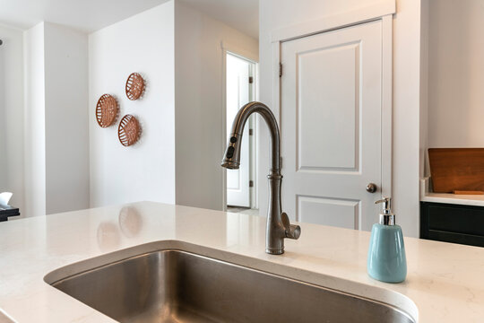 Stainless steel sink with deck mounted one-handle faucet
