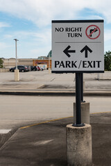 Park and Exit directional sign in a parking lot