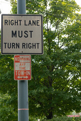 Right lane must turn right street sign with no parking sign below